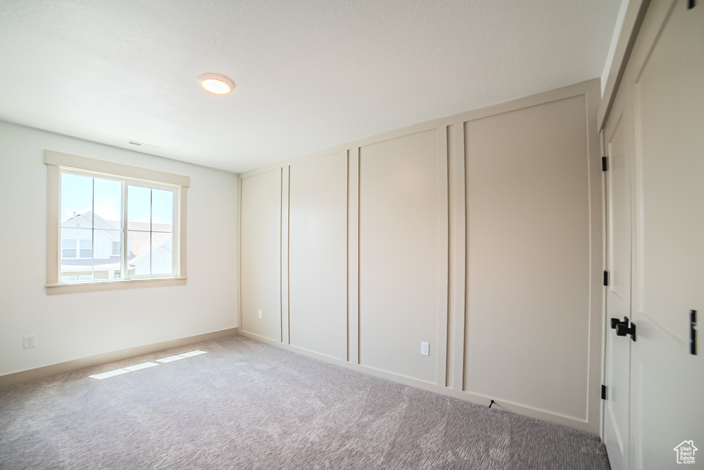Unfurnished bedroom featuring carpet floors