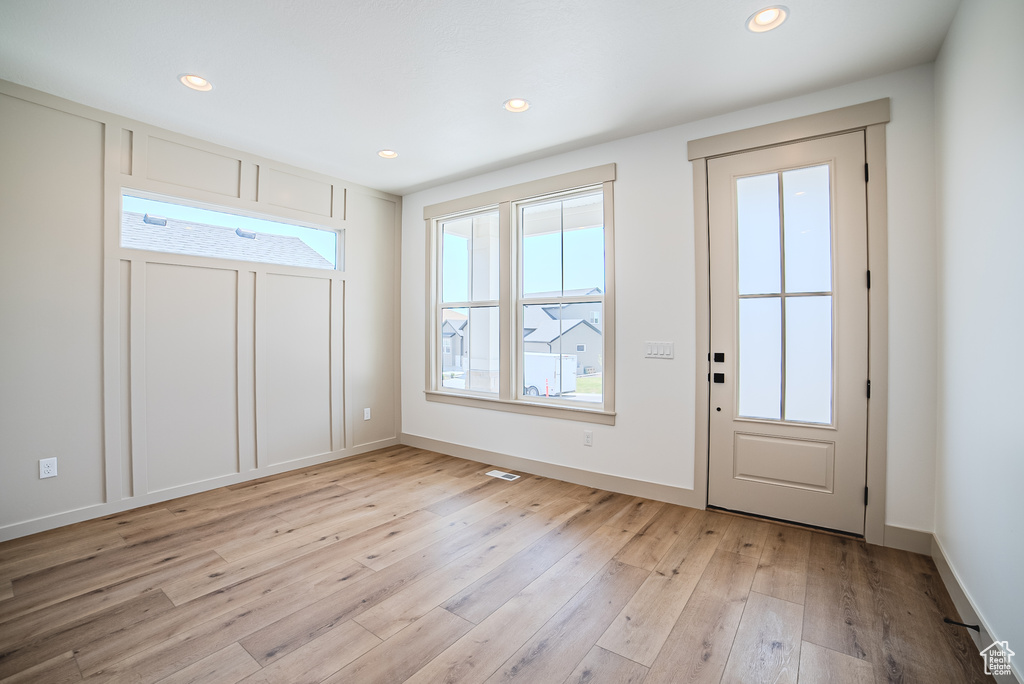 Entrance foyer featuring light wood-type flooring and recessed lighting