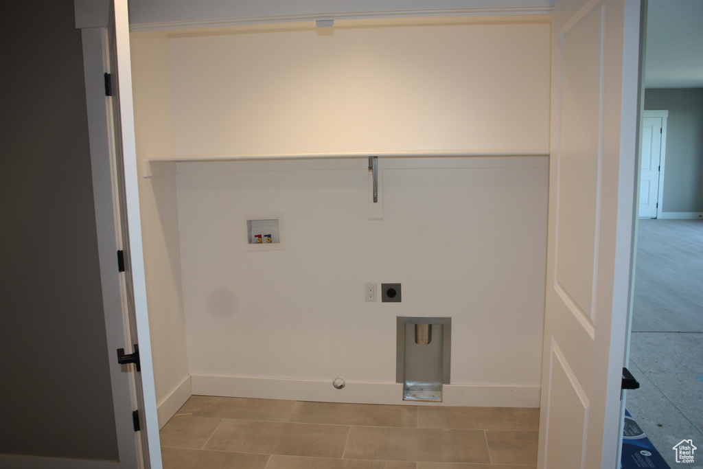 Laundry area featuring hookup for a washing machine, hookup for an electric dryer, and gas dryer hookup