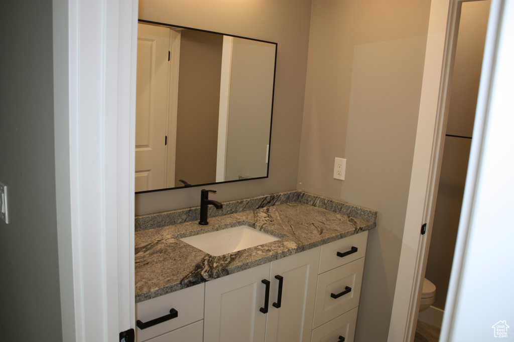 Bathroom with vanity and toilet