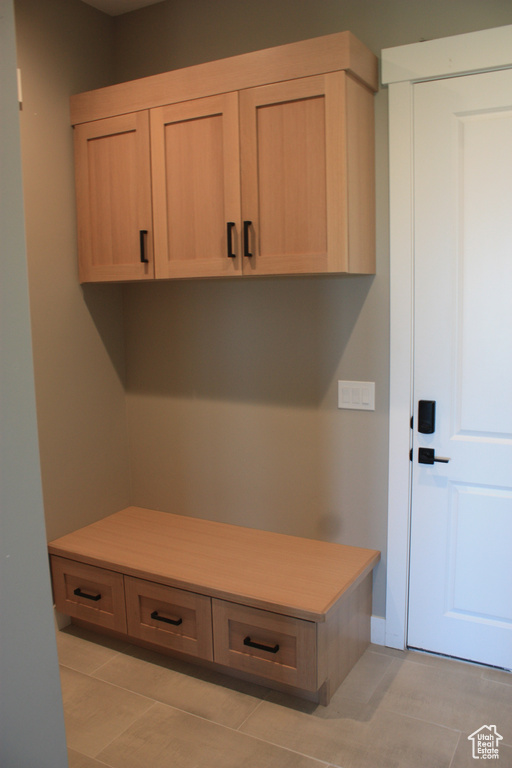 Mudroom featuring light tile patterned floors