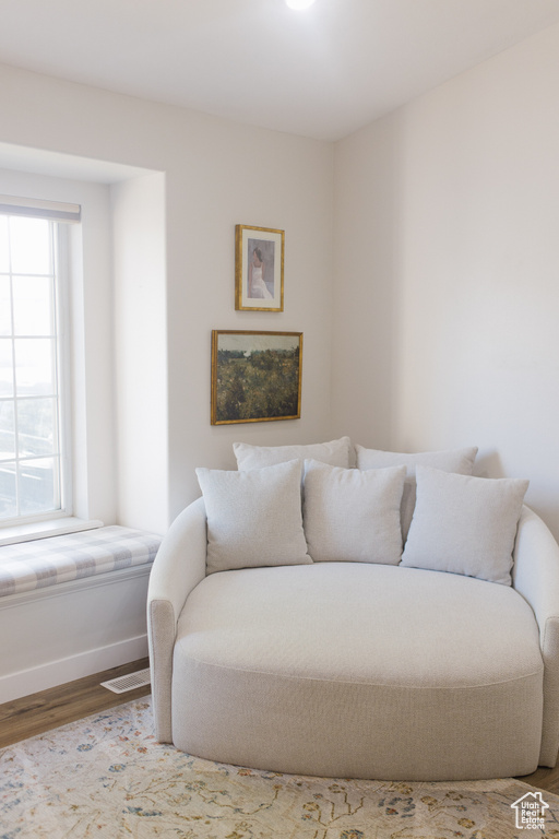 Bedroom with wood finished floors and baseboards
