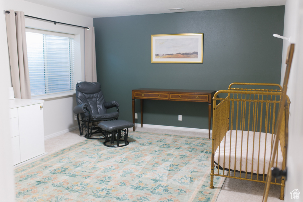 Living area with carpet and baseboards