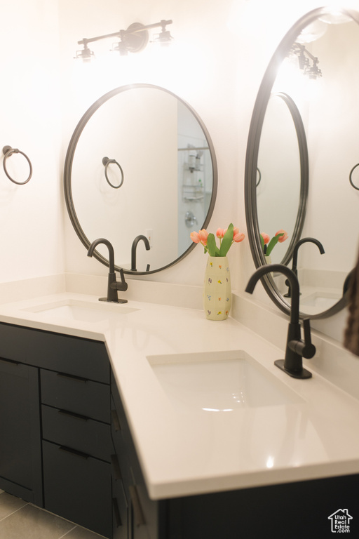 Full bath featuring double vanity