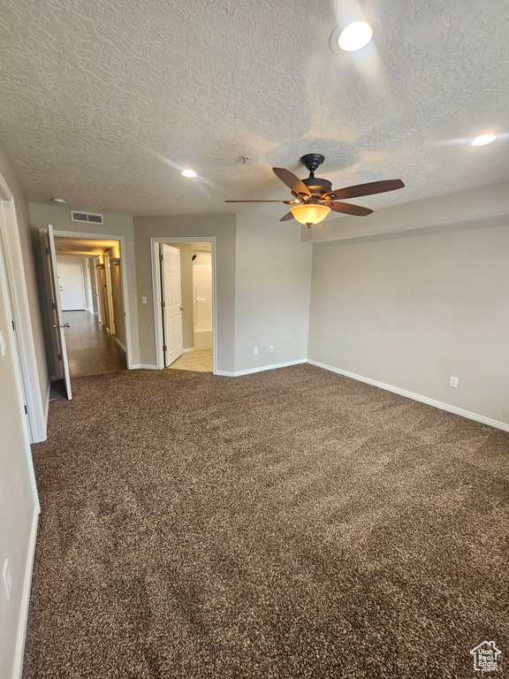 Spare room featuring a ceiling fan, light colored carpet, a textured ceiling, and recessed lighting