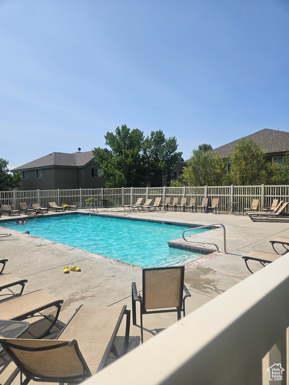 Community pool with a patio area