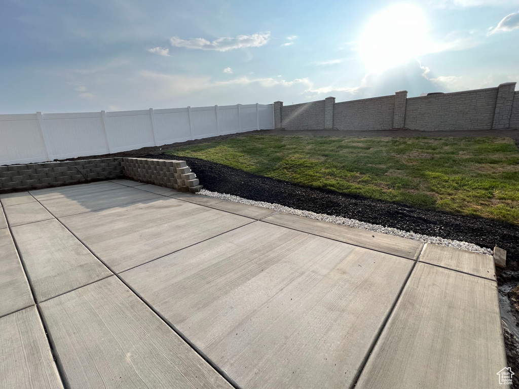 Fenced backyard featuring a patio