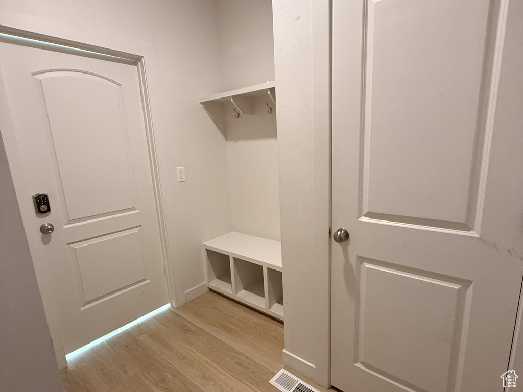 Mudroom featuring light wood-type flooring