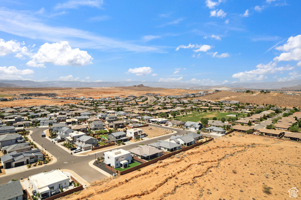 Aerial view of residential area featuring a mountainous background