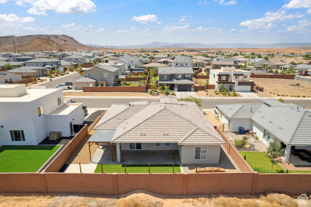 Aerial view of residential area featuring mountains