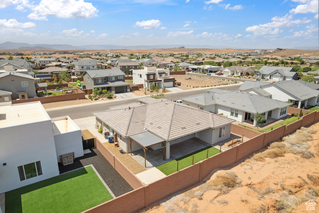 Aerial view of residential area featuring mountains