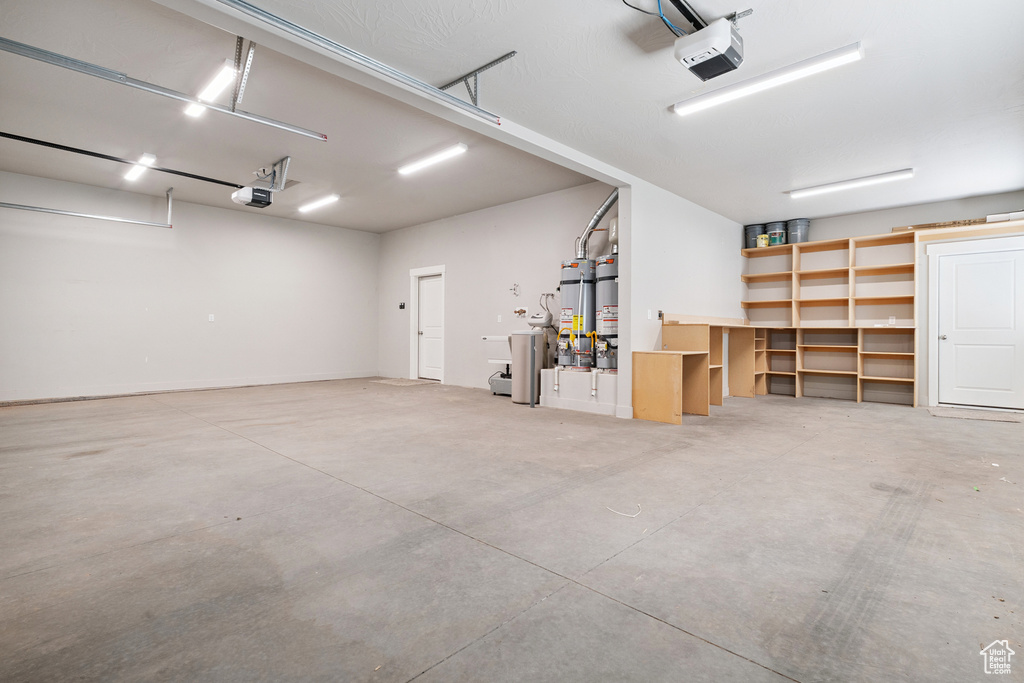 Garage with a garage door opener and water heater