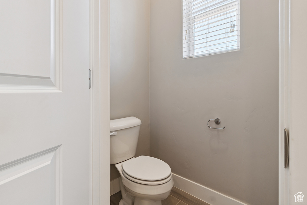 Bathroom with baseboards and toilet