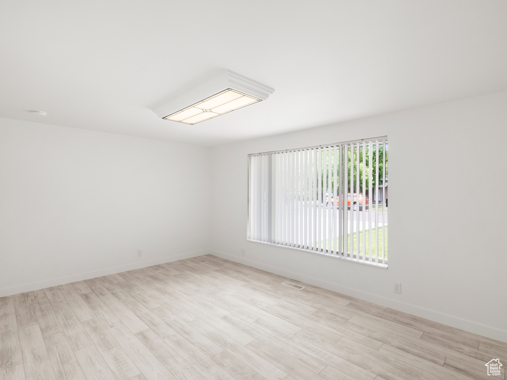 Unfurnished room with light wood finished floors
