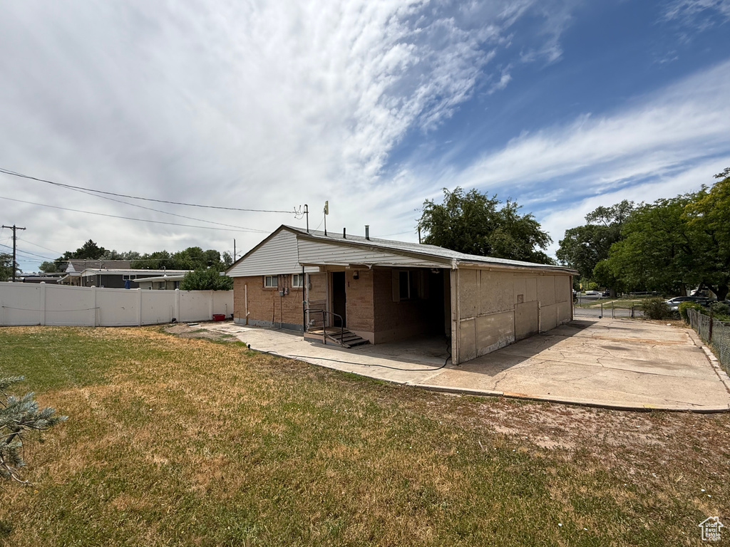 Rear view of property with a patio and entry steps