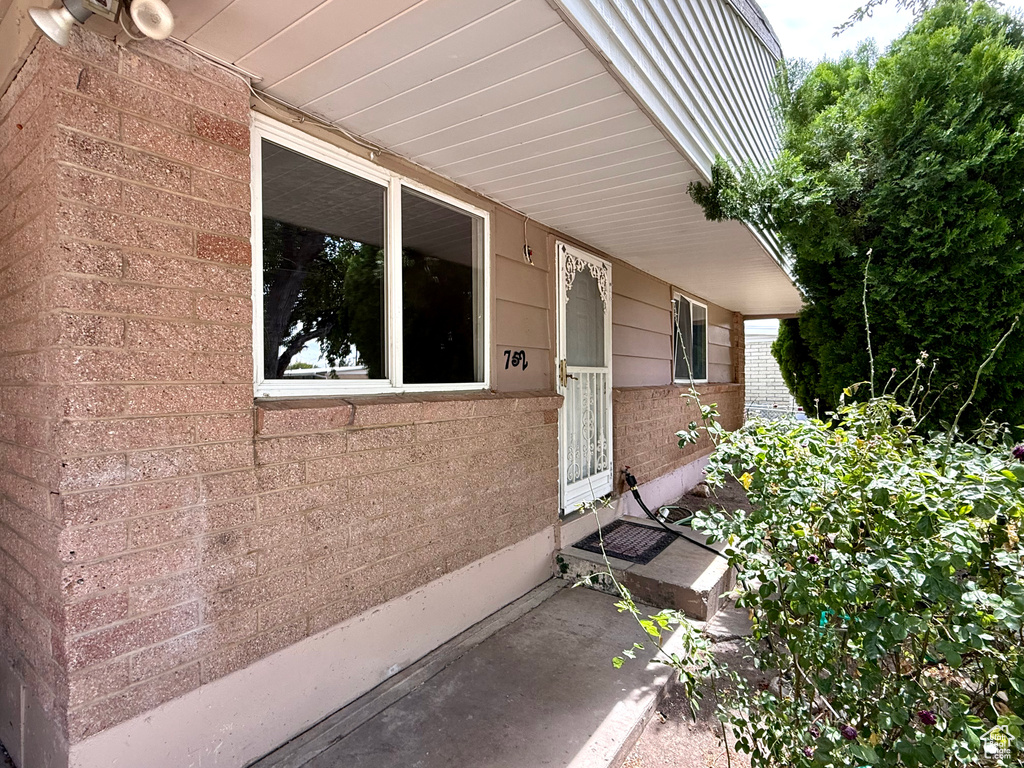 Property entrance with brick siding