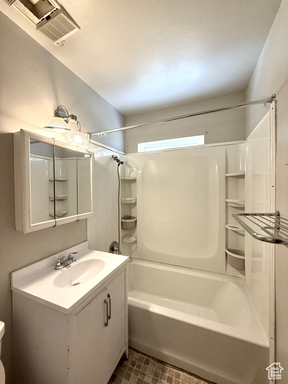 Bathroom with  shower combination, vanity, and tile patterned floors