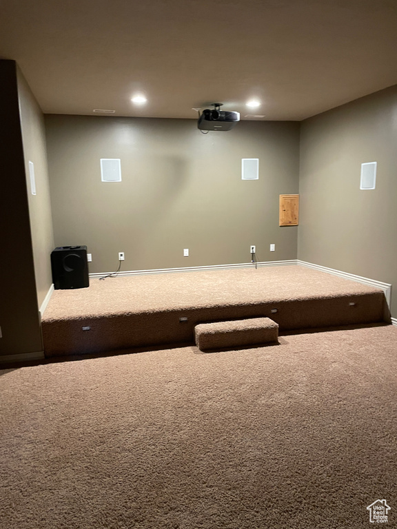 Cinema room with carpet flooring and recessed lighting
