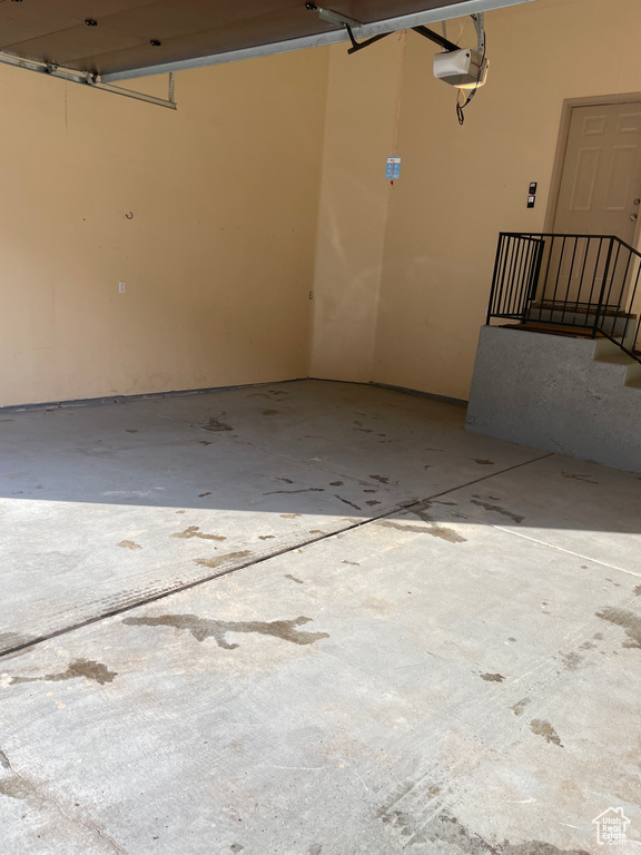 Garage featuring a garage door opener