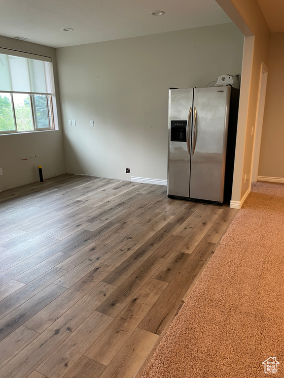Kitchen with stainless steel fridge and wood finished floors