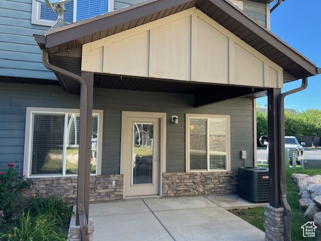 Property entrance featuring stone siding