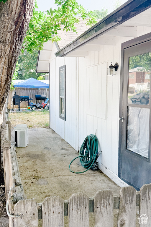 Doorway to property featuring a patio