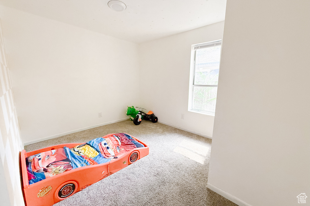Playroom featuring carpet and baseboards
