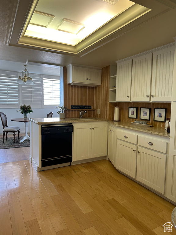 Kitchen with dishwasher, light wood-style floors, open shelves, and a chandelier