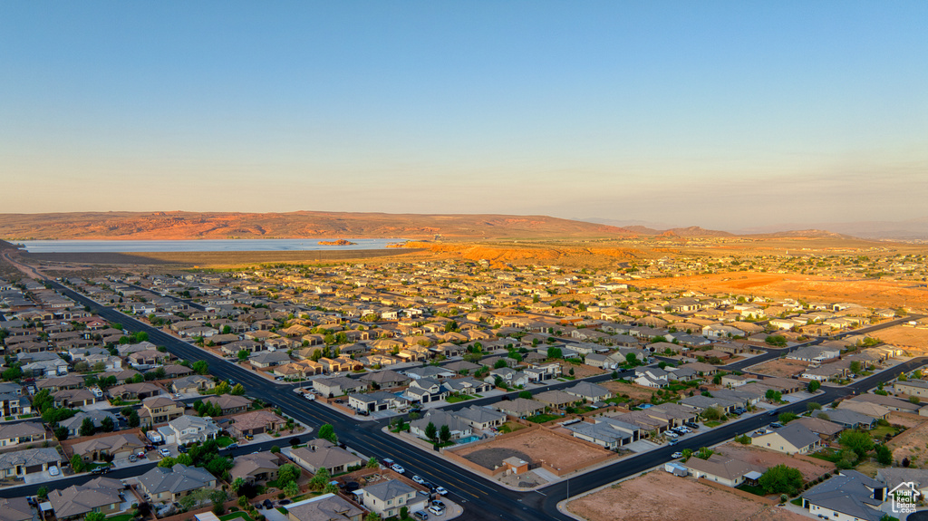 View of property location featuring nearby suburban area and a water and mountain view