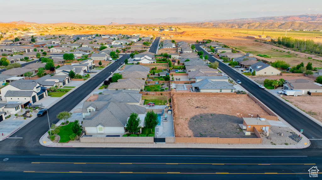 Aerial perspective of suburban area with a mountainous background