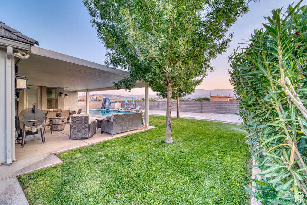 Fenced backyard with a patio