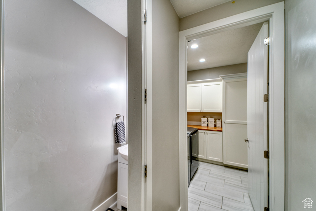 Corridor featuring recessed lighting