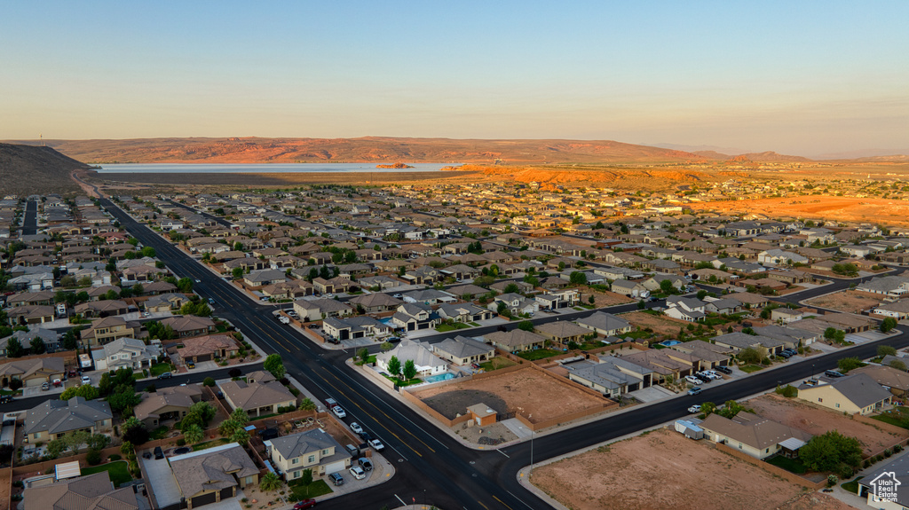 Aerial perspective of suburban area featuring a mountainous background