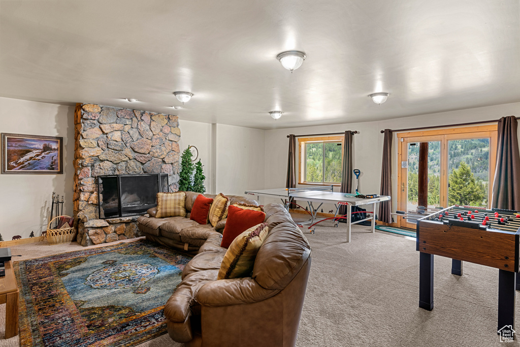 Carpeted living room with a fireplace