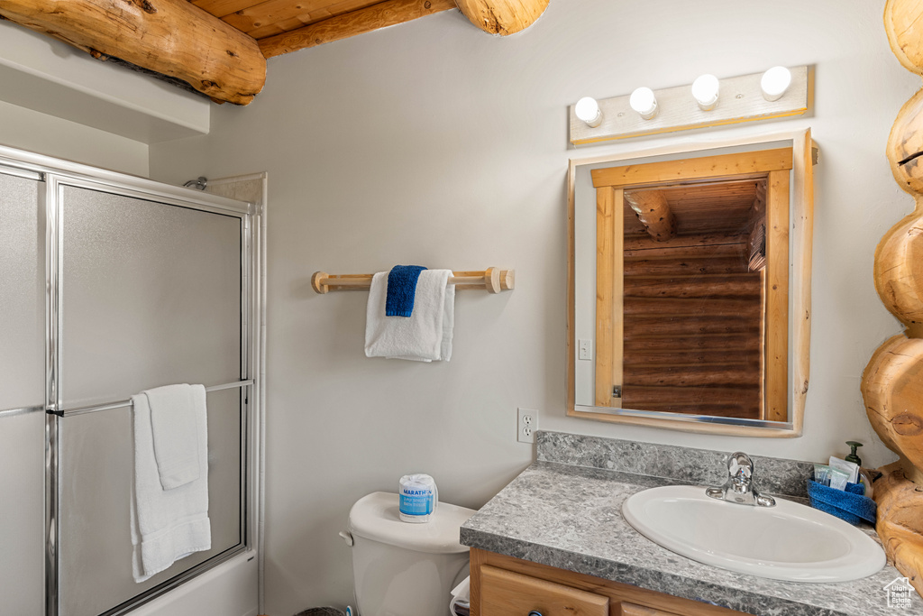 Full bathroom with toilet and vanity