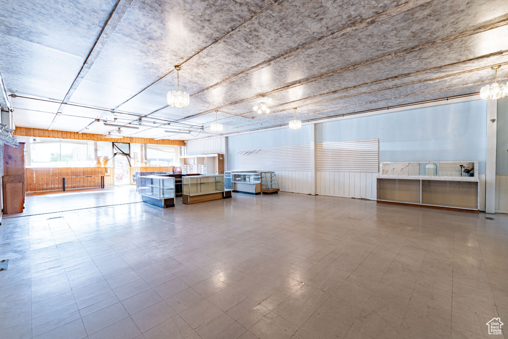 Garage featuring a wainscoted wall
