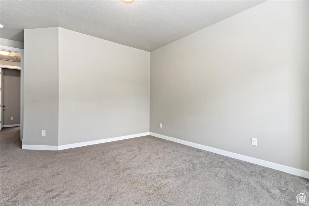 Unfurnished room with carpet floors