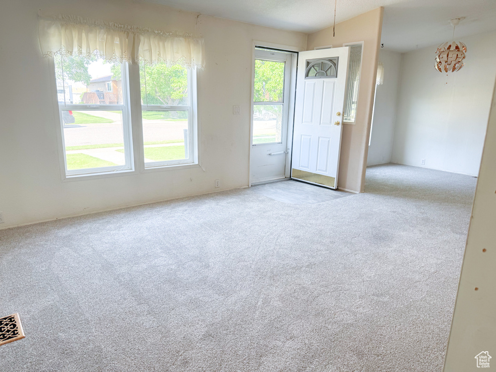 Empty room featuring carpet flooring