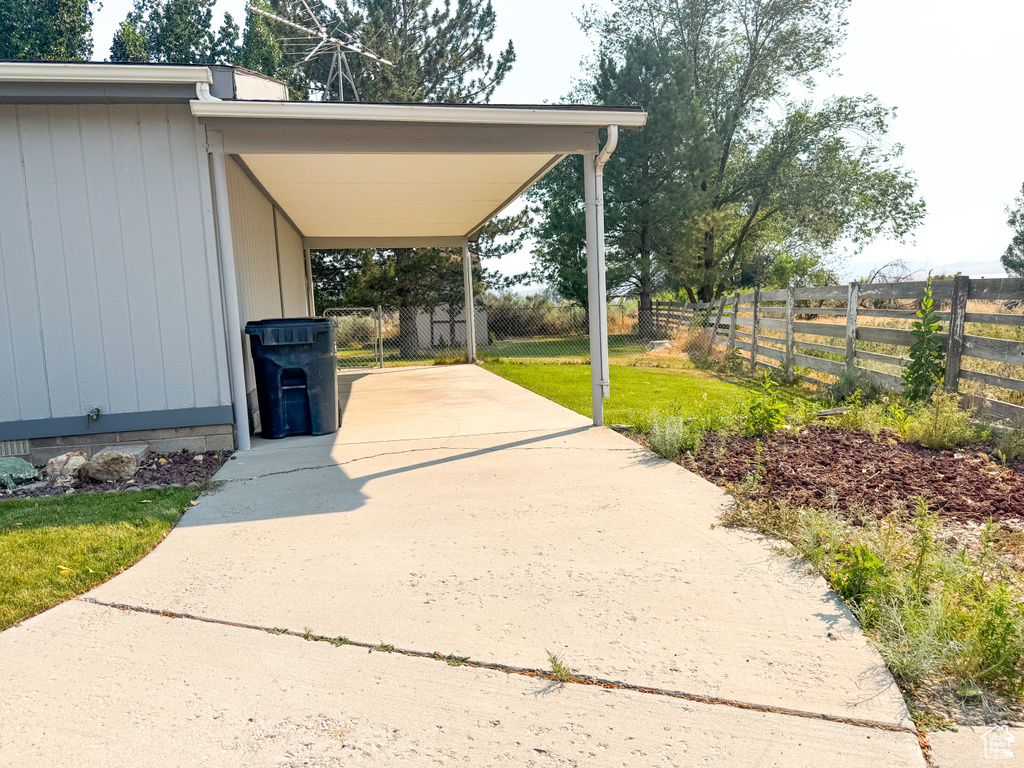 View of vehicle parking featuring driveway
