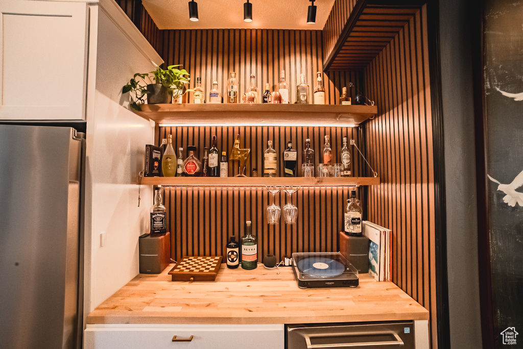 Bar area featuring fridge
