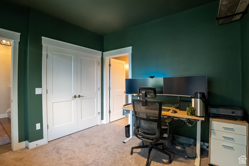 Carpeted office with baseboards