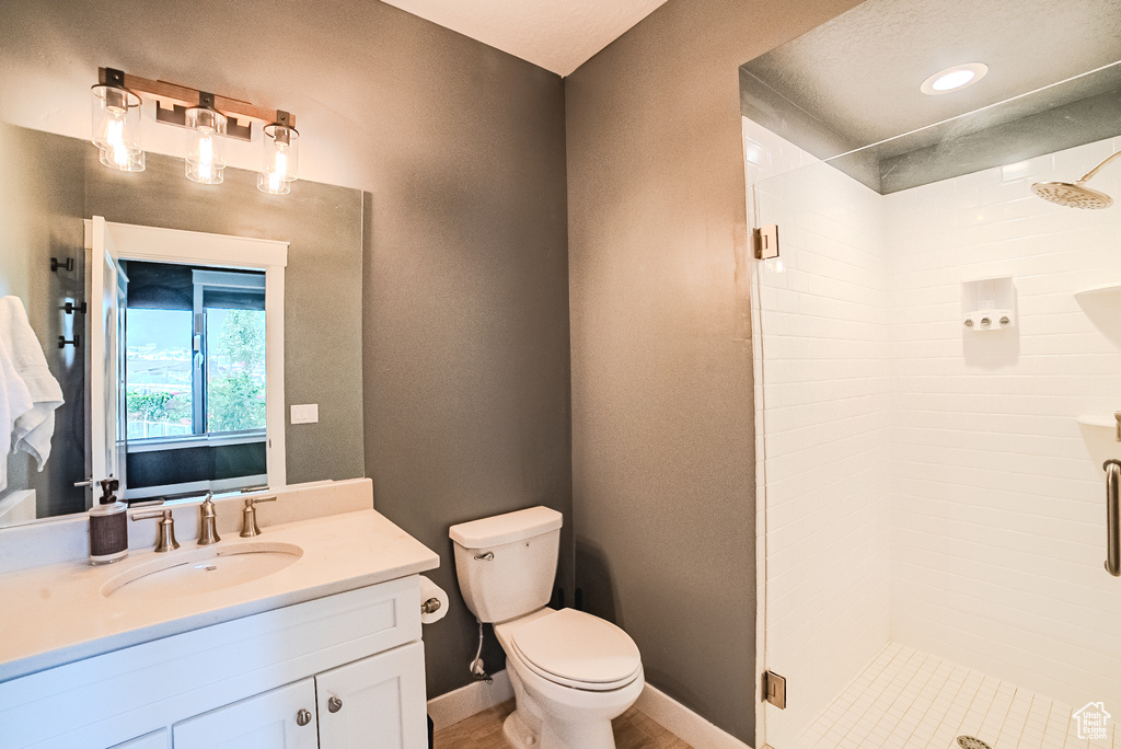 Full bathroom with a stall shower and vanity
