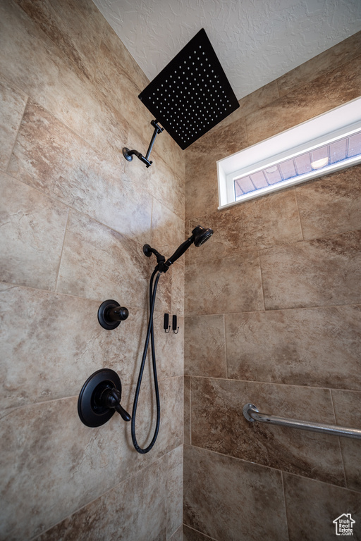 Bathroom featuring tiled shower