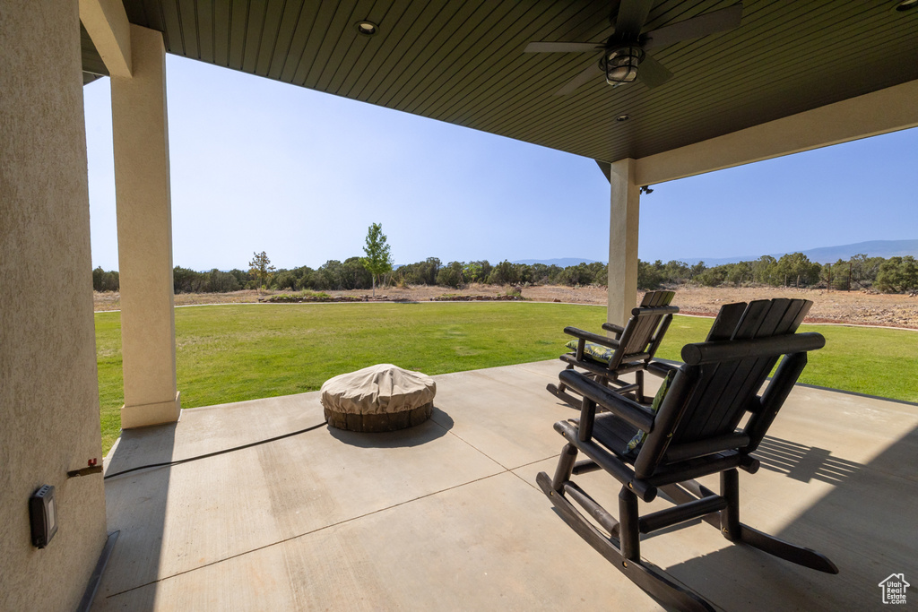 View of patio / terrace featuring a view of rural / pastoral area and a ceiling fan