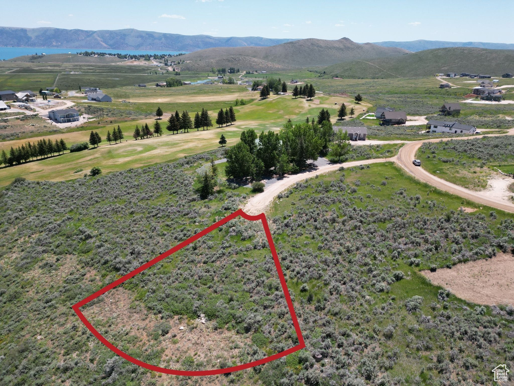 Aerial overview of property's location featuring property parcel outlined and mountains