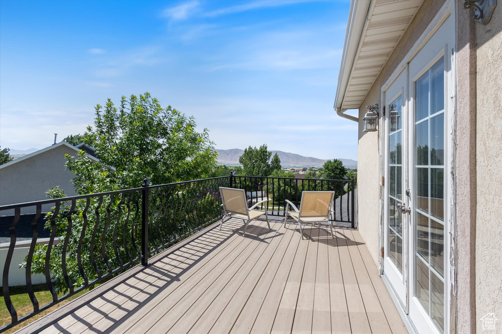 Wooden terrace with a mountain view and french doors