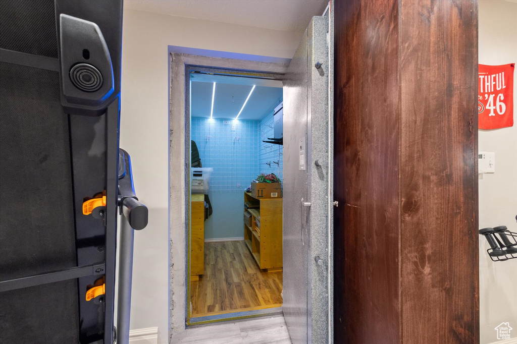 Hallway with wood finished floors