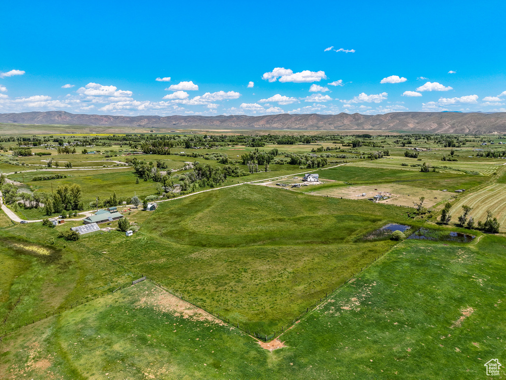 Overview of rural landscape featuring a mountainous background