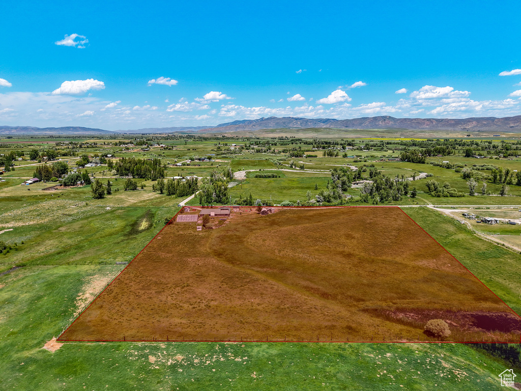 Aerial view of sparsely populated area with a mountainous background