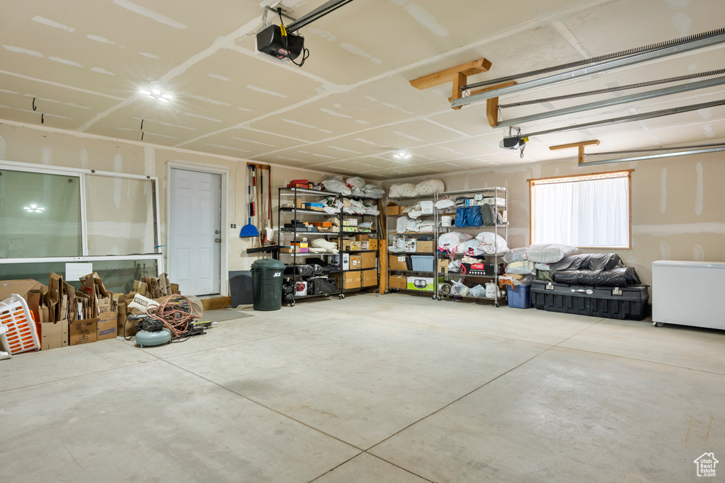 Garage featuring a garage door opener